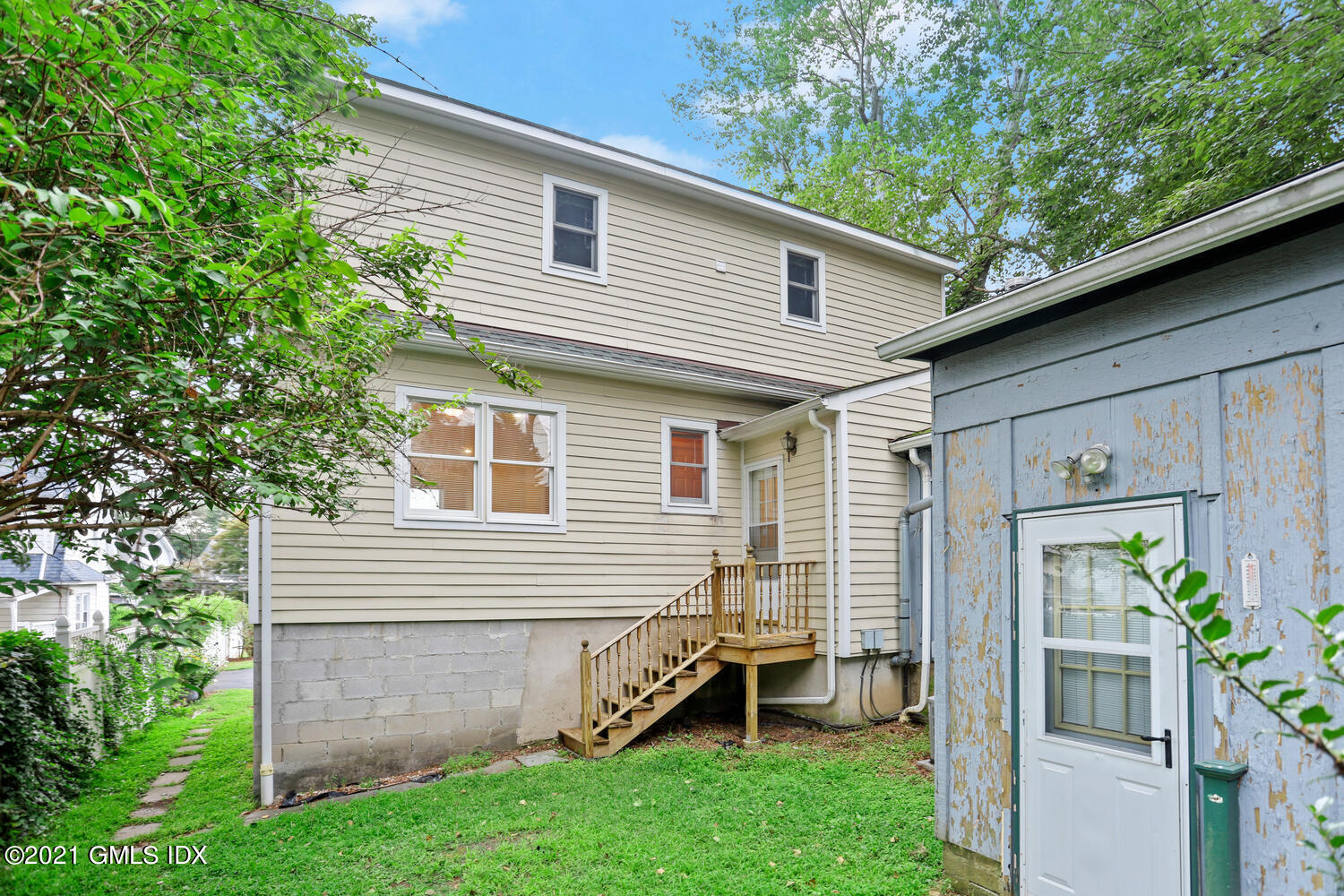 284 Glenbrook Road Stamford, CT 06906 - Photo 37 of 45 a view of house with a backyard space and a garden