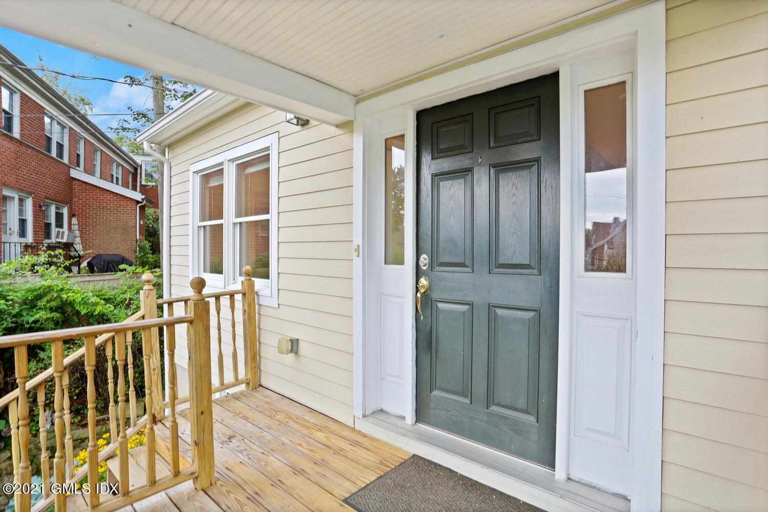 284 Glenbrook Road Stamford, CT 06906 - Photo 4 of 45 front view of a house with a glass door