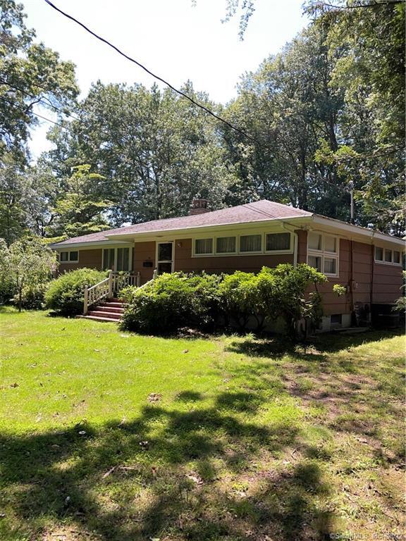 99 Plattsville Road Bridgeport, CT 06606 - Photo 1 of 1 a house view with a swimming pool and garden