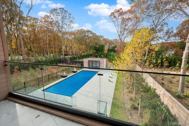 a view of a bathroom shower and a sink