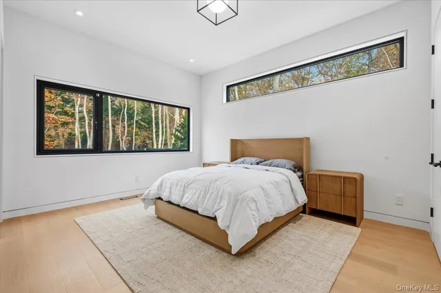 a bathroom with a sink toilet a mirror and shower
