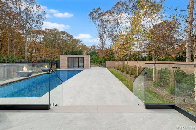 a view of a swimming pool with a patio