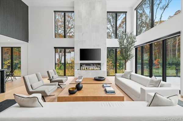 a living room with fireplace furniture and a flat screen tv
