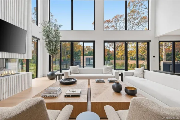 a living room with furniture fireplace and flat screen tv