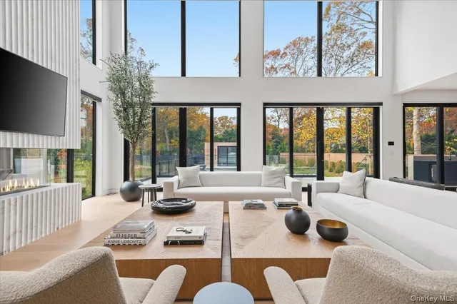 a living room with furniture fireplace and flat screen tv
