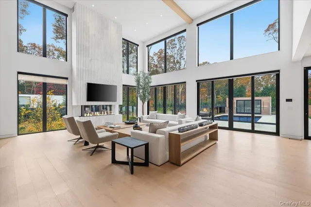 a living room with furniture and large flat screen tv