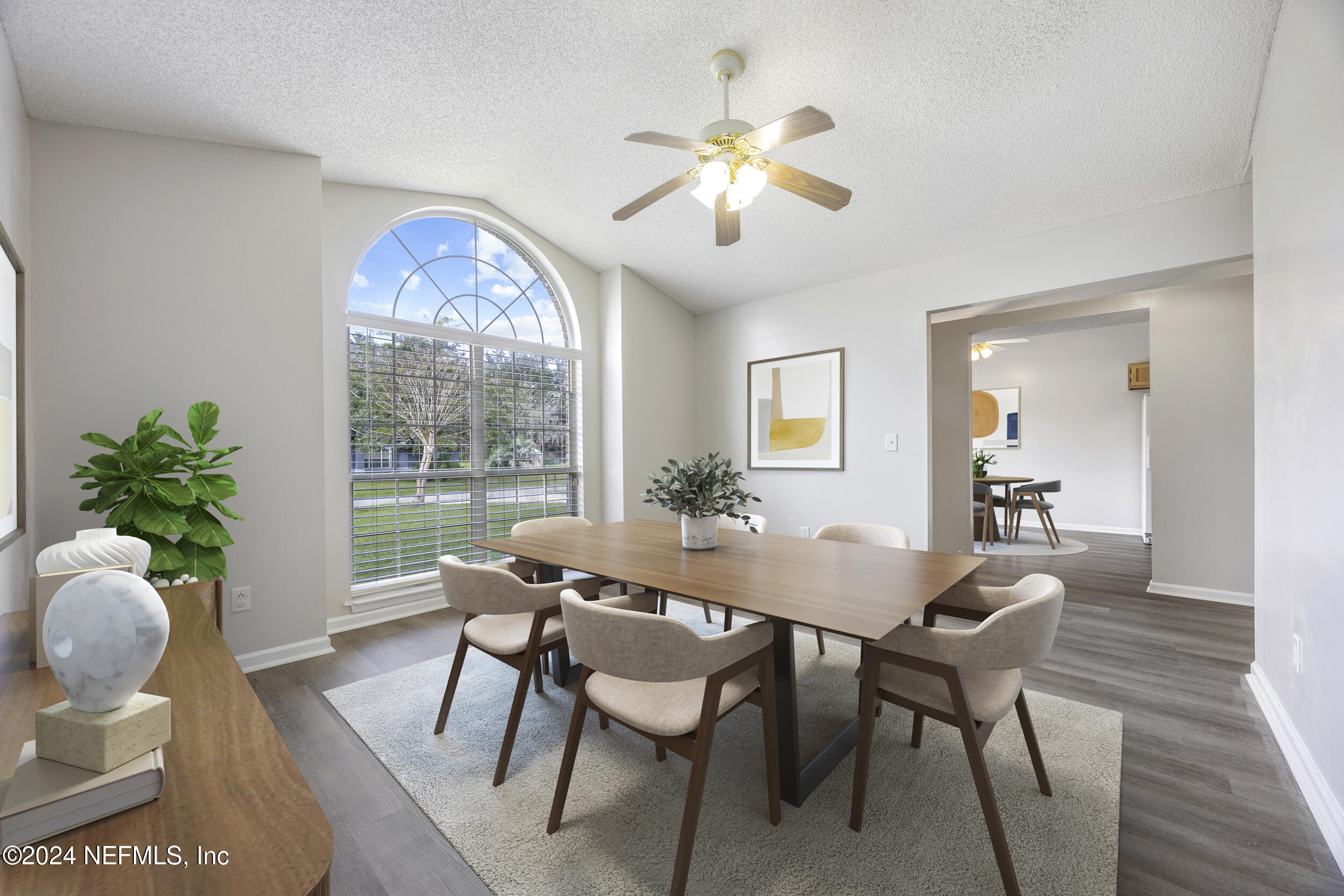 781 Nottingham Forest Circle St. Johns, FL 32259 - Photo 14 of 43 a dining room with furniture potted plants and wooden floor