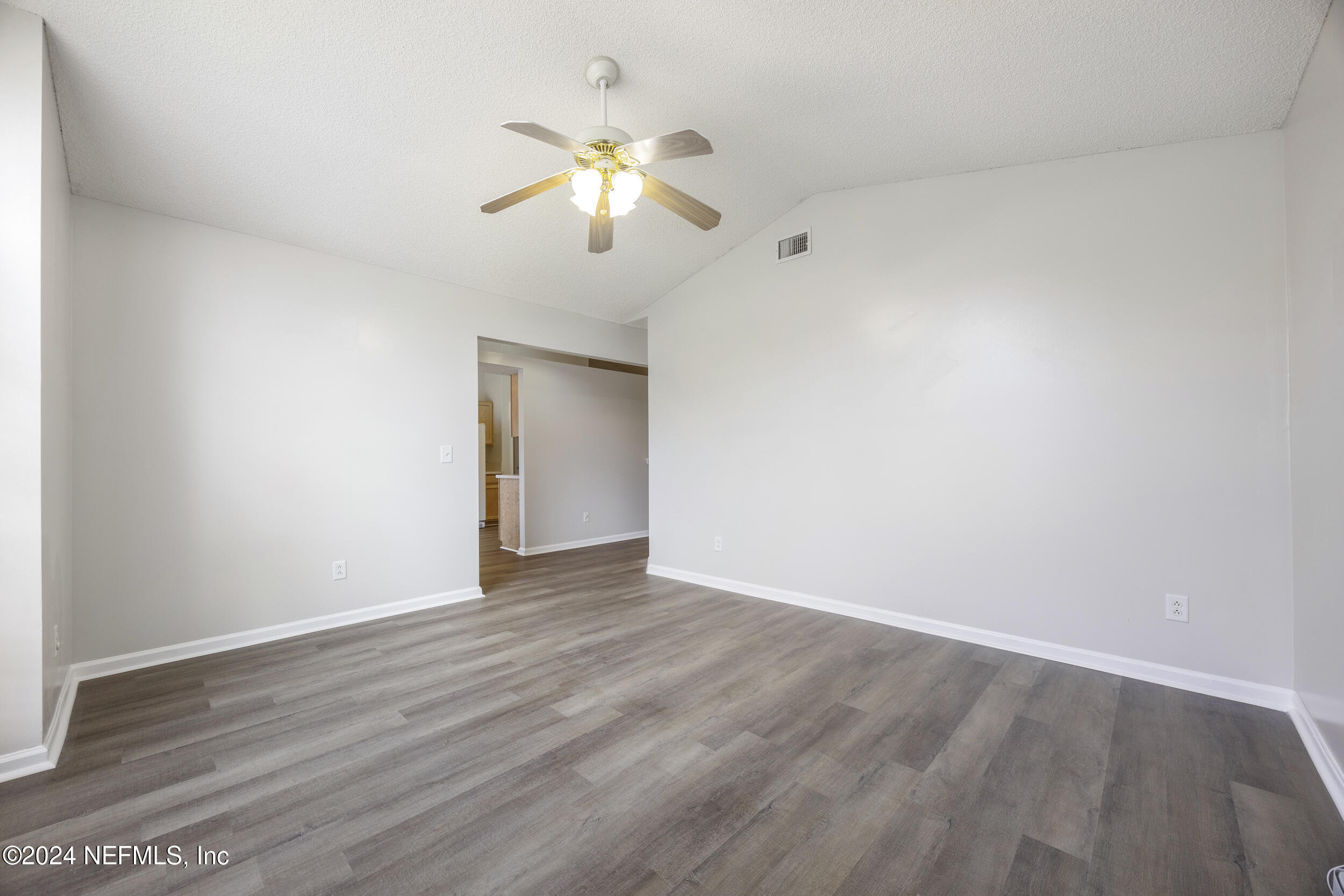 781 Nottingham Forest Circle St. Johns, FL 32259 - Photo 16 of 43 a view of an empty room with wooden floor