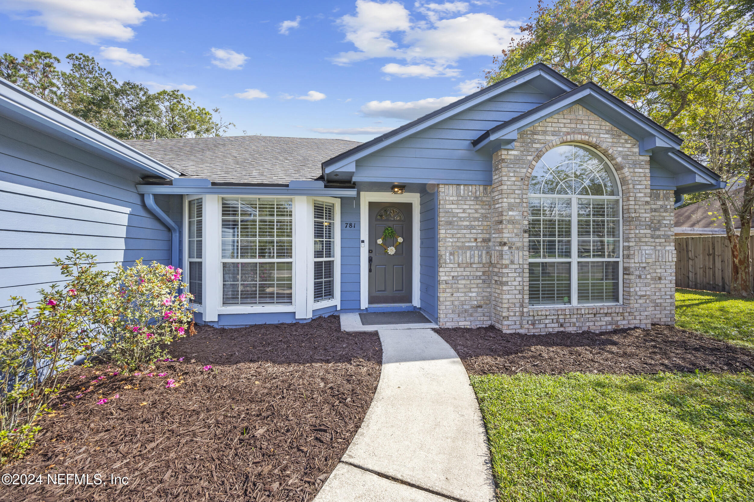 781 Nottingham Forest Circle St. Johns, FL 32259 - Photo 2 of 43 a front view of a house with garden