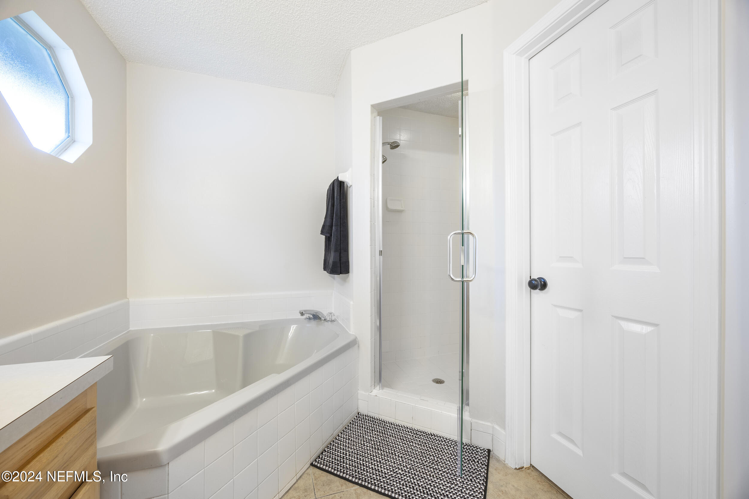 781 Nottingham Forest Circle St. Johns, FL 32259 - Photo 21 of 43 a bathroom with a bathtub and a shower