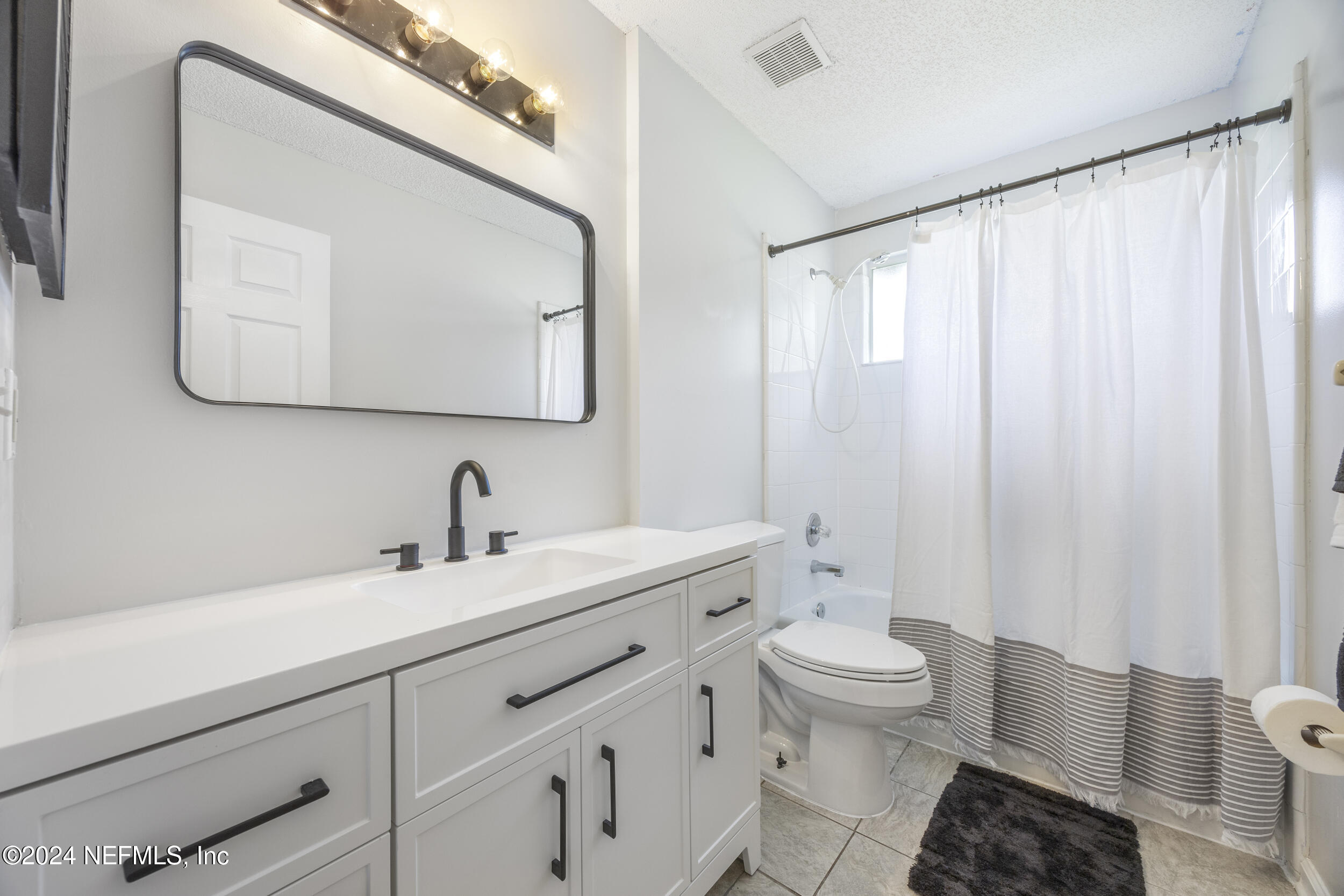 781 Nottingham Forest Circle St. Johns, FL 32259 - Photo 24 of 43 a bathroom with a toilet a sink and a mirror