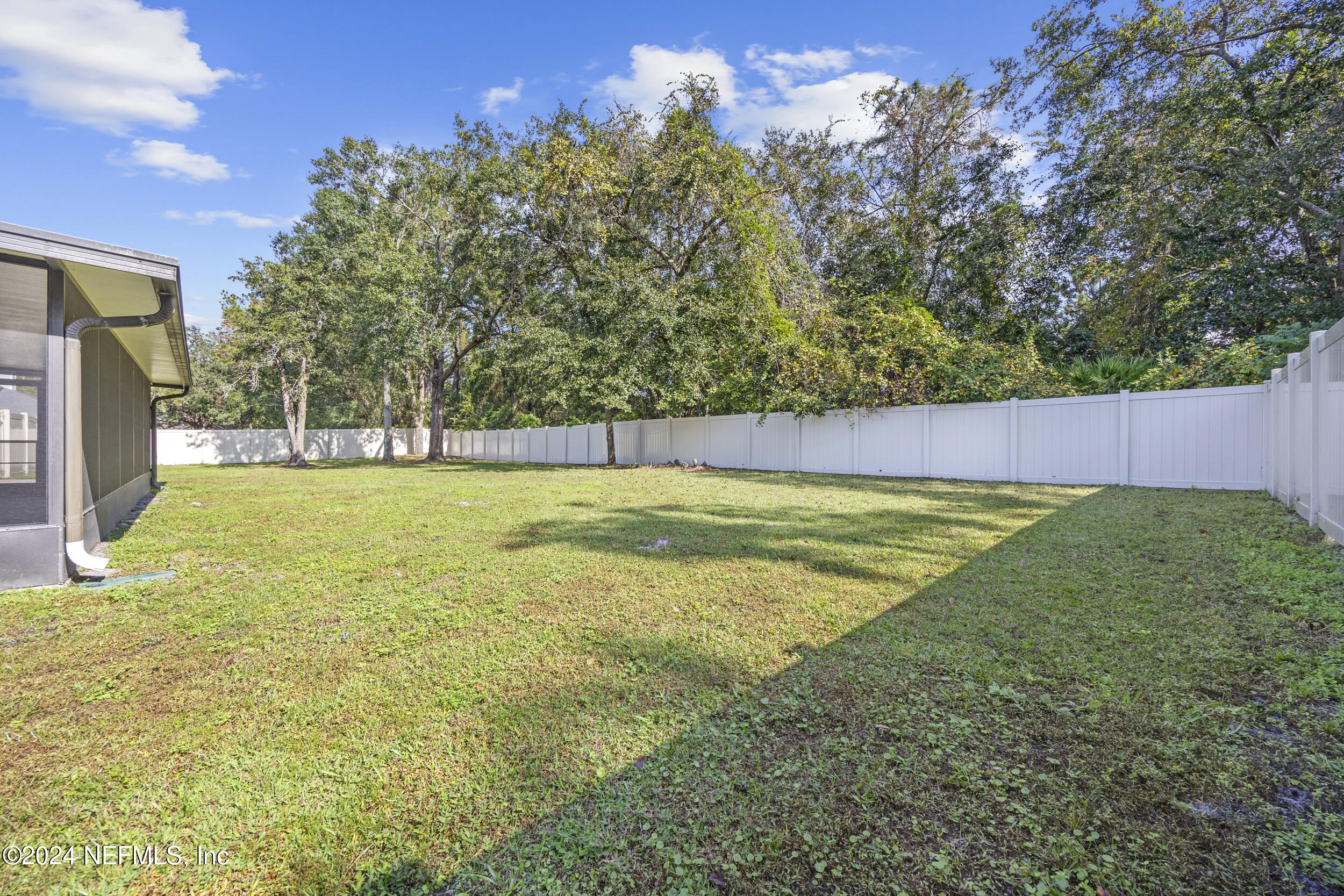 781 Nottingham Forest Circle St. Johns, FL 32259 - Photo 31 of 43 a view of a yard with a house in the background