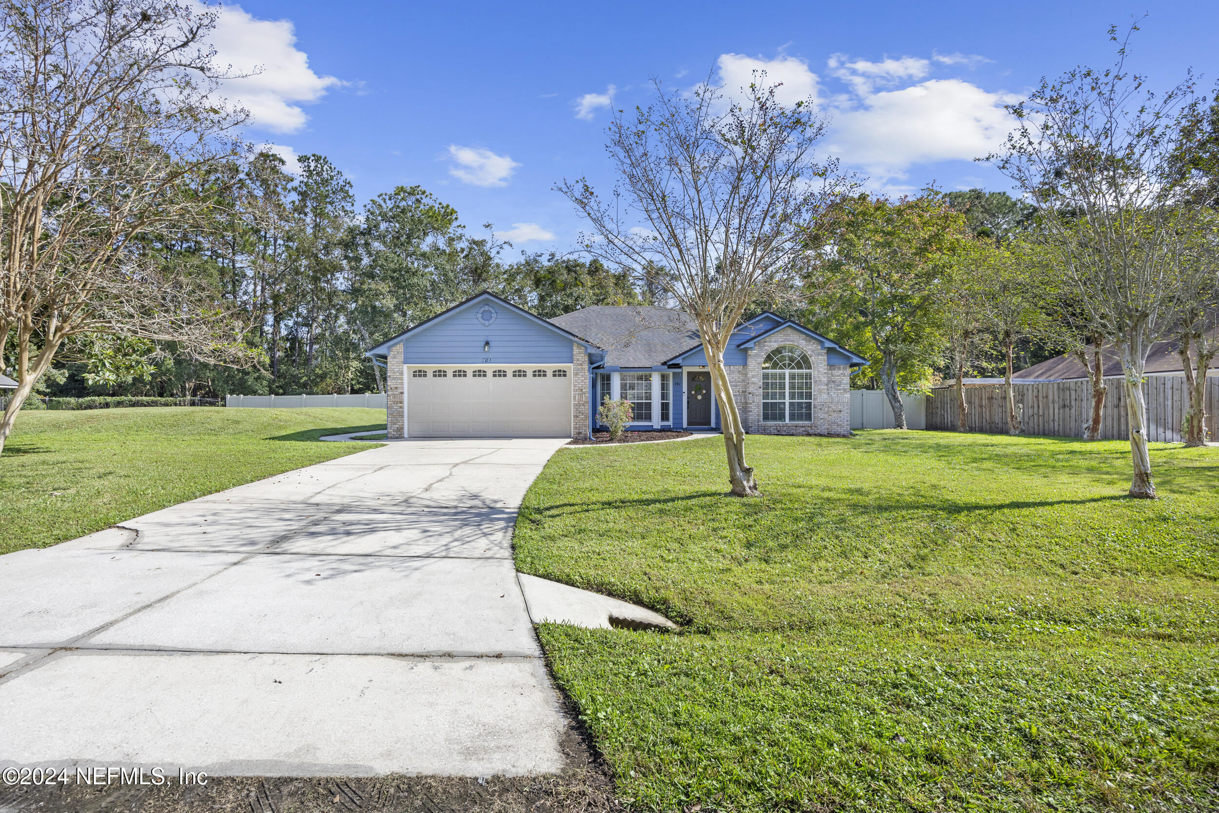 781 Nottingham Forest Circle St. Johns, FL 32259 - Photo 32 of 43 a house with huge green field in front of it