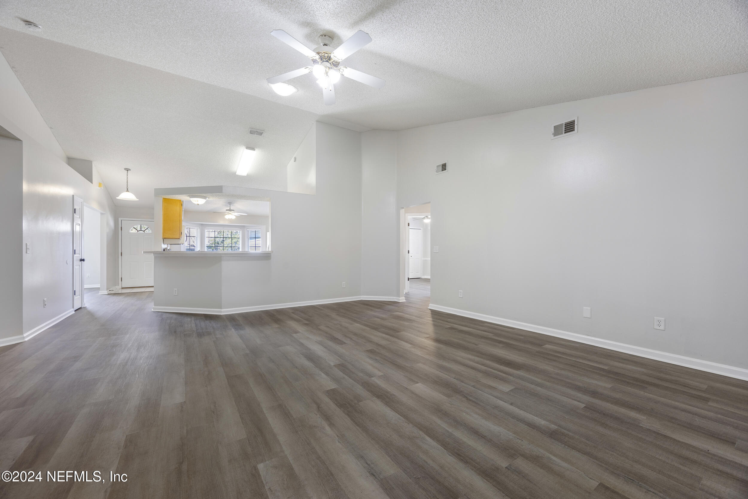 781 Nottingham Forest Circle St. Johns, FL 32259 - Photo 6 of 43 wooden floor in an empty room with a window