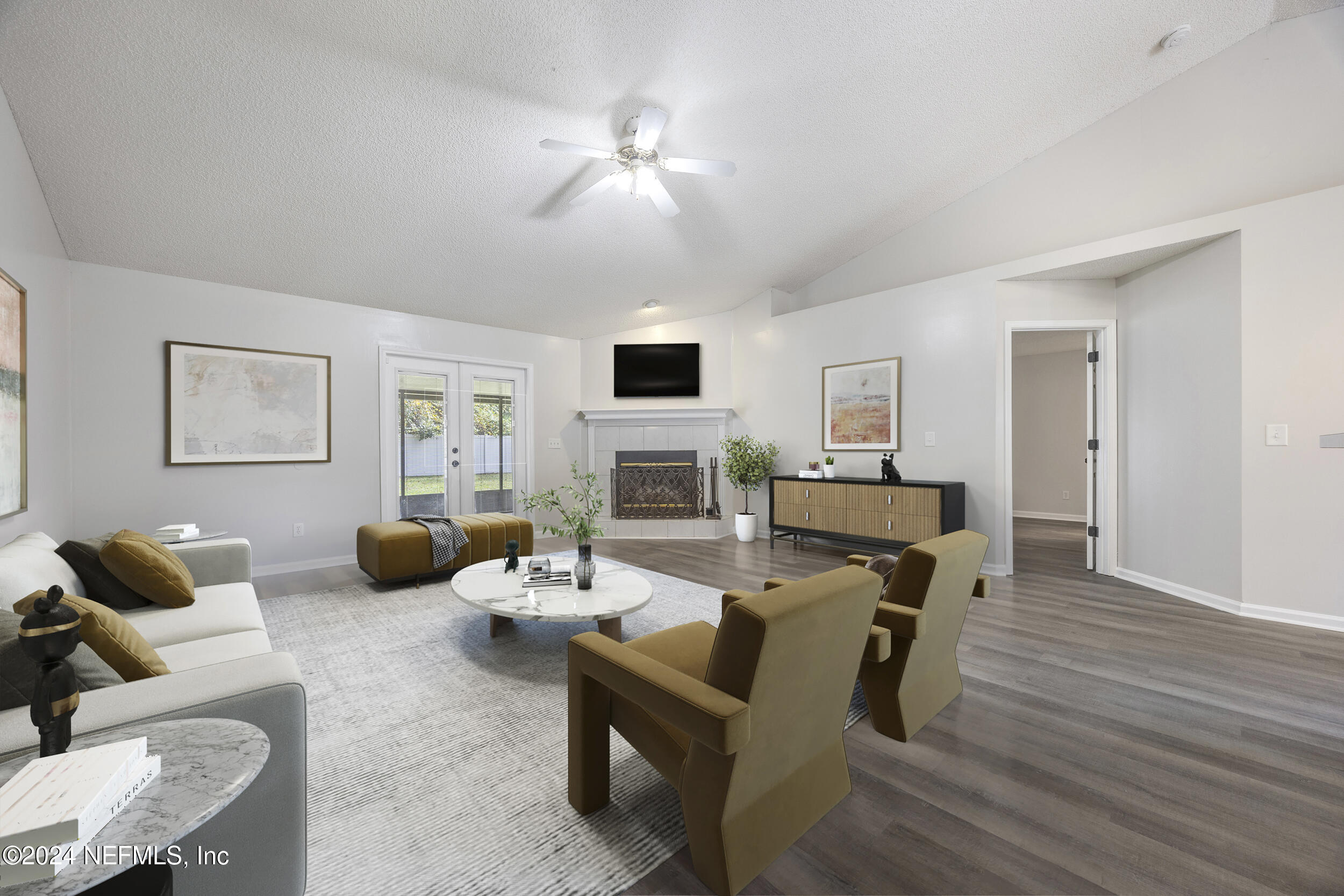 781 Nottingham Forest Circle St. Johns, FL 32259 - Photo 8 of 43 a living room with furniture a fireplace and a flat screen tv