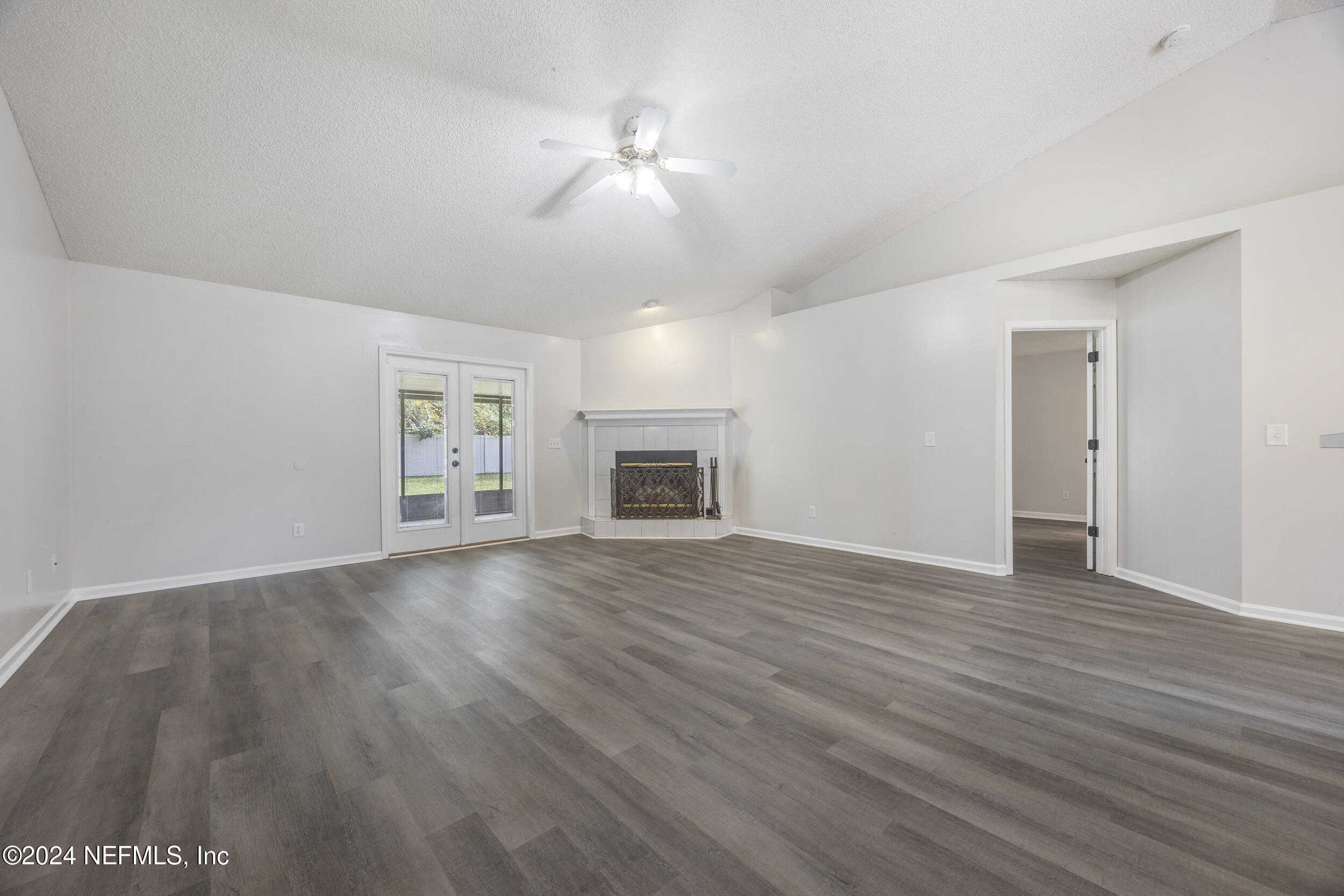 781 Nottingham Forest Circle St. Johns, FL 32259 - Photo 9 of 43 a view of an empty room with wooden floor and a window