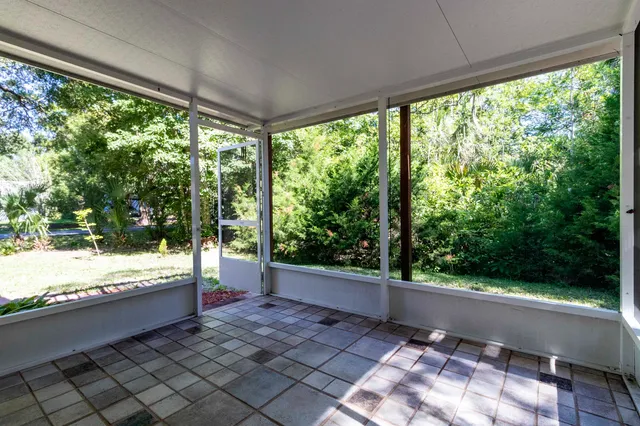 a bathroom with a toilet and a shower curtain