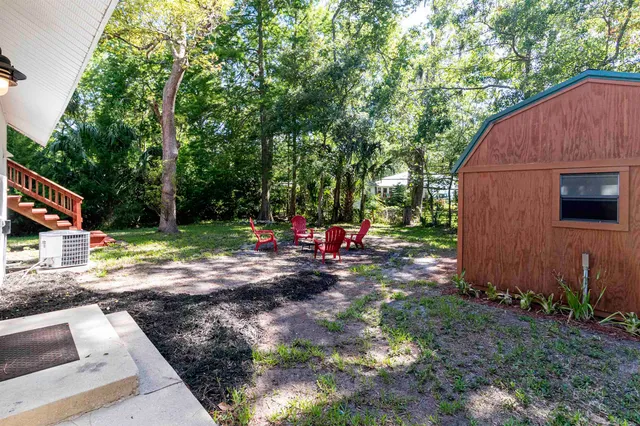 a view of a park with large trees