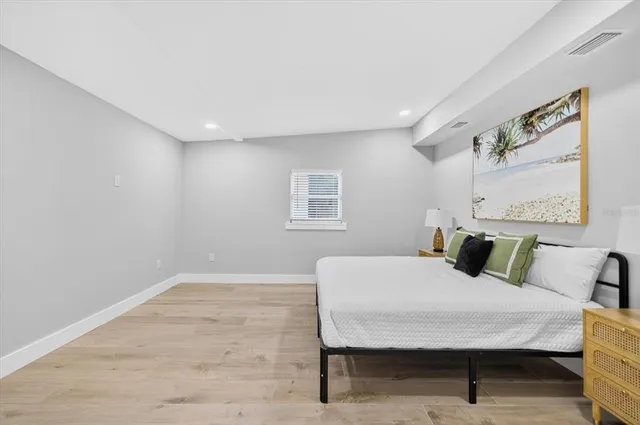 a bedroom with a bed and a table