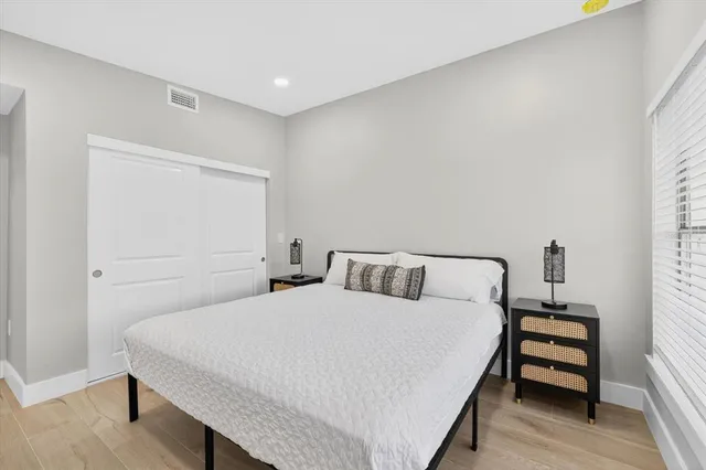 a bedroom with a bed and a table