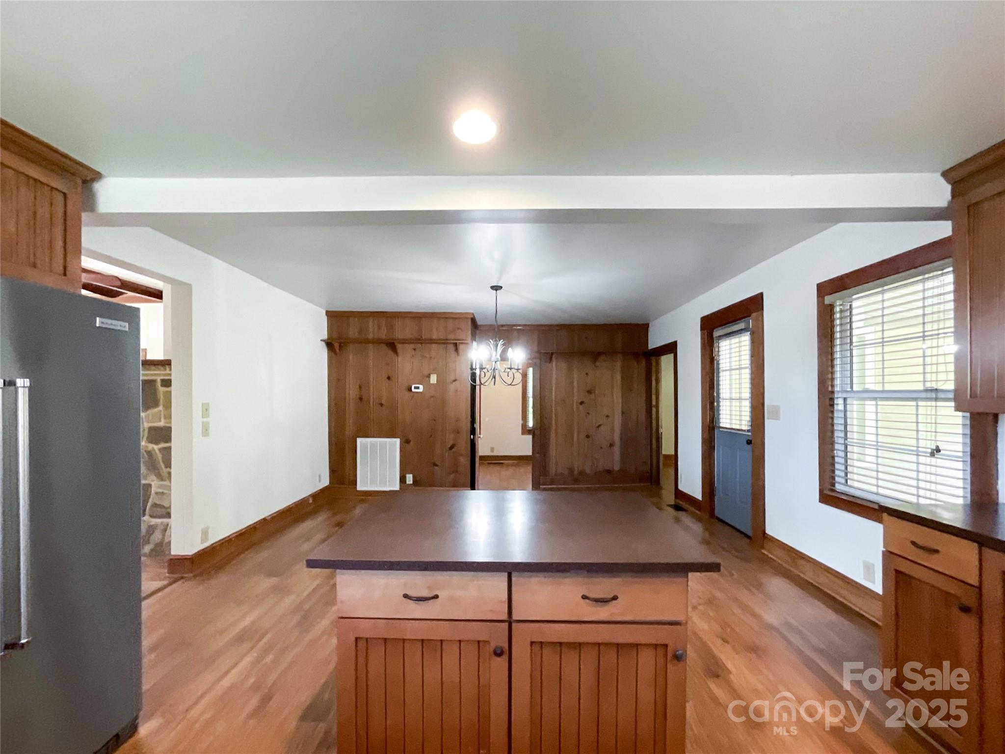 2006 Okeewemee Road Star, NC 27356 - Photo 11 of 48 a kitchen with kitchen island a center island wooden floor and a window