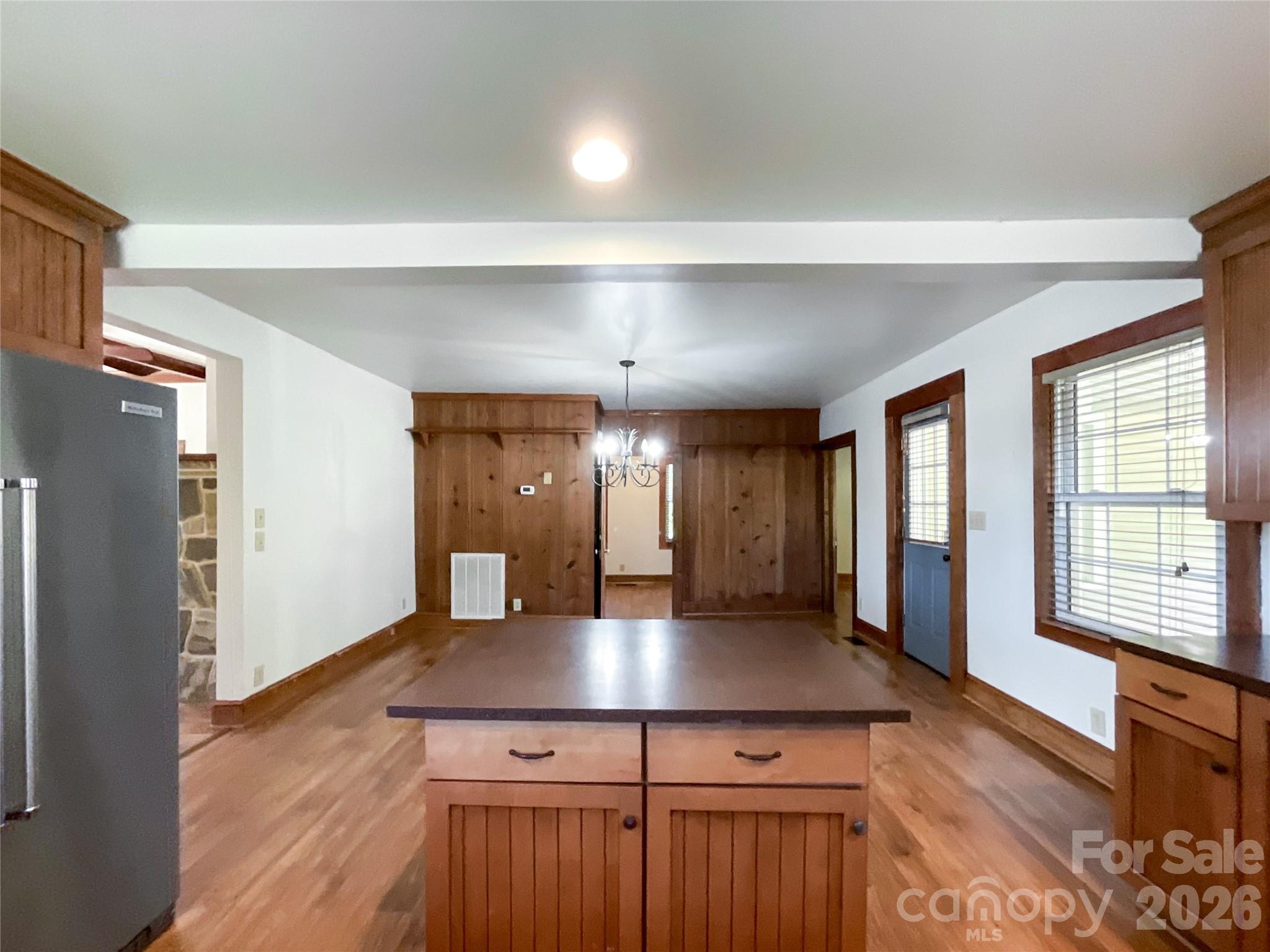 2006 Okeewemee Road Star, NC 27356 - Photo 11 of 47 a kitchen with kitchen island a center island wooden floor and a window