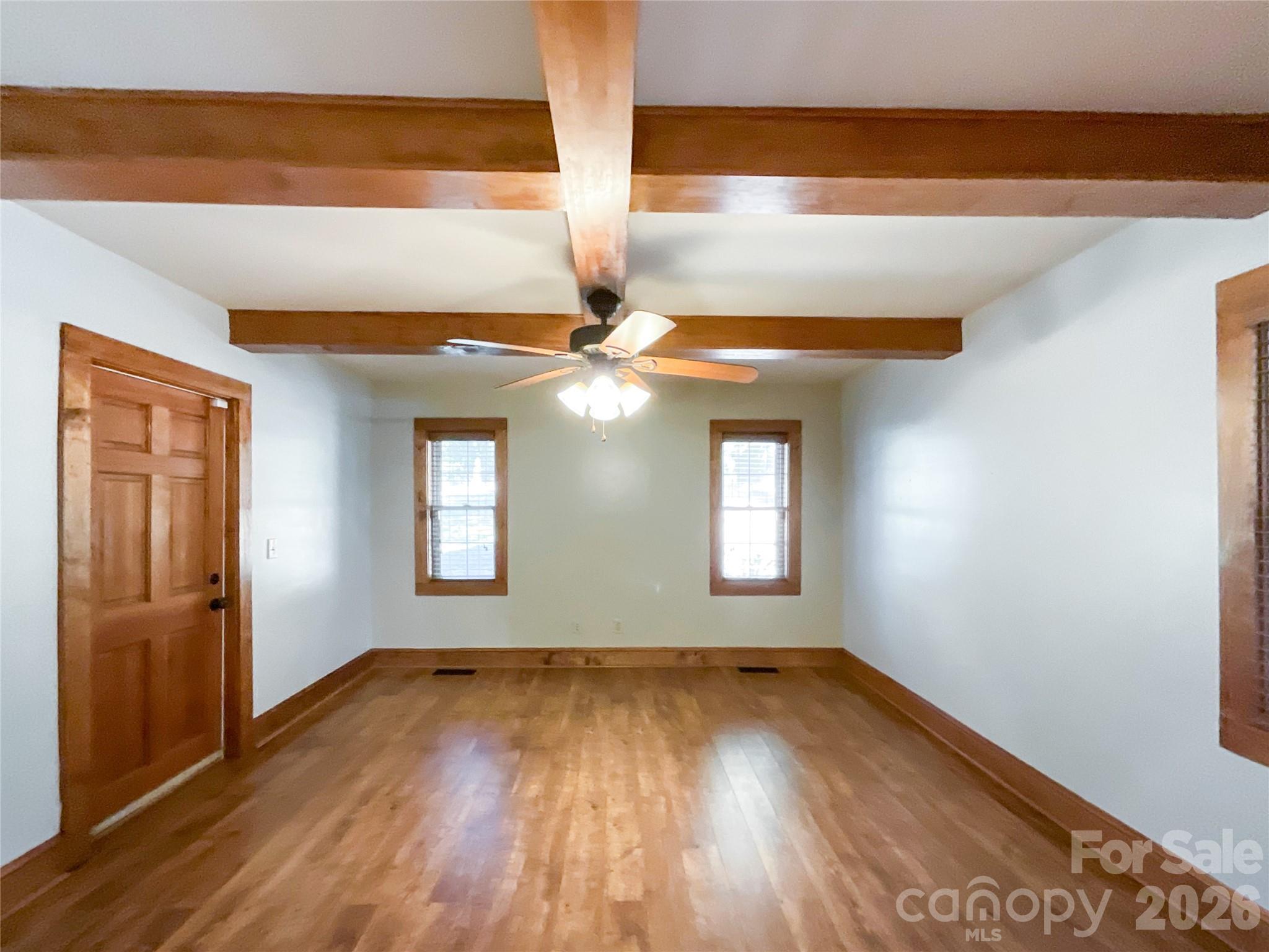 2006 Okeewemee Road Star, NC 27356 - Photo 14 of 47 an empty room with wooden floor and windows