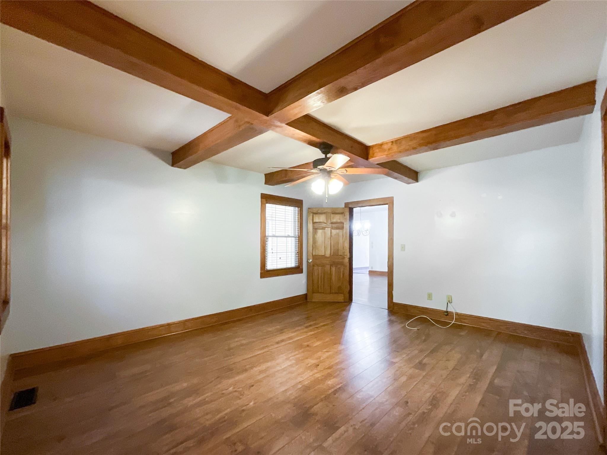 2006 Okeewemee Road Star, NC 27356 - Photo 16 of 48 an empty room with wooden floor and windows