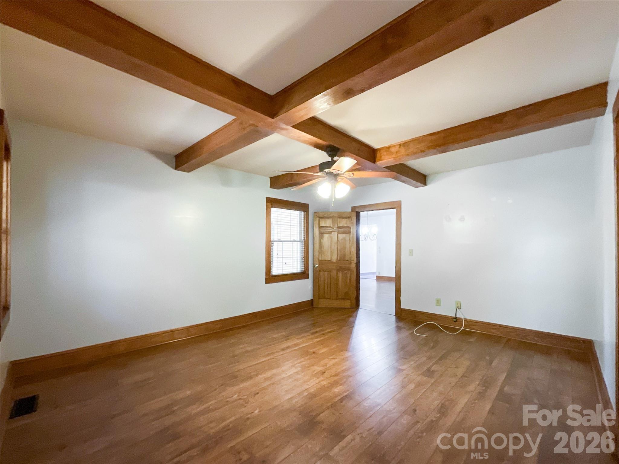 2006 Okeewemee Road Star, NC 27356 - Photo 16 of 47 an empty room with wooden floor and windows