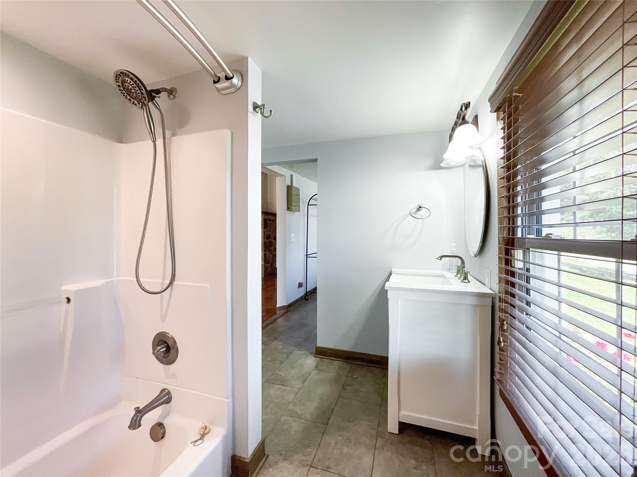 2006 Okeewemee Road Star, NC 27356 - Photo 24 of 47 a bathroom with a tub shower vanity and a sink