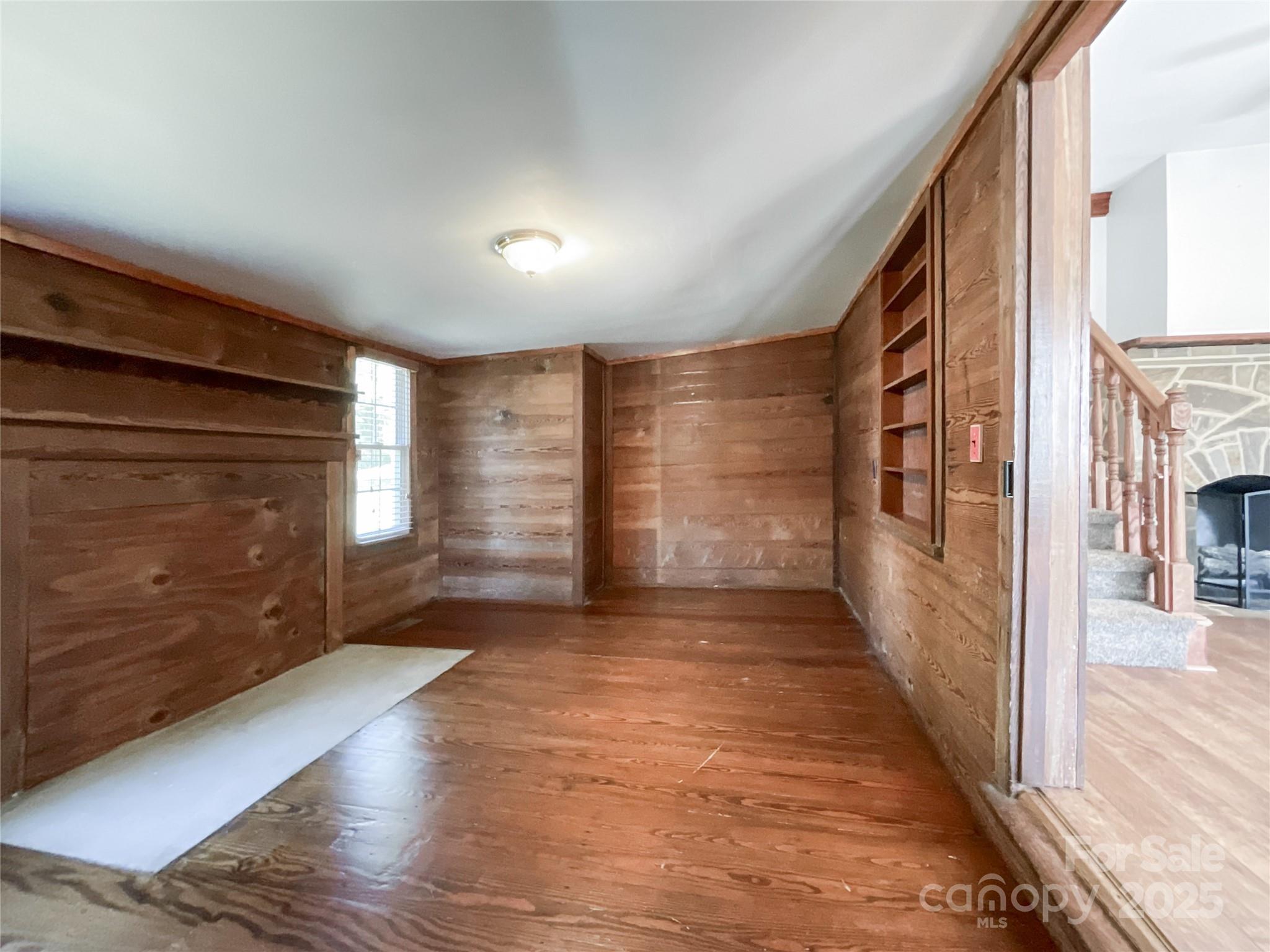 2006 Okeewemee Road Star, NC 27356 - Photo 26 of 48 a view of an empty room with wooden floor and a fireplace