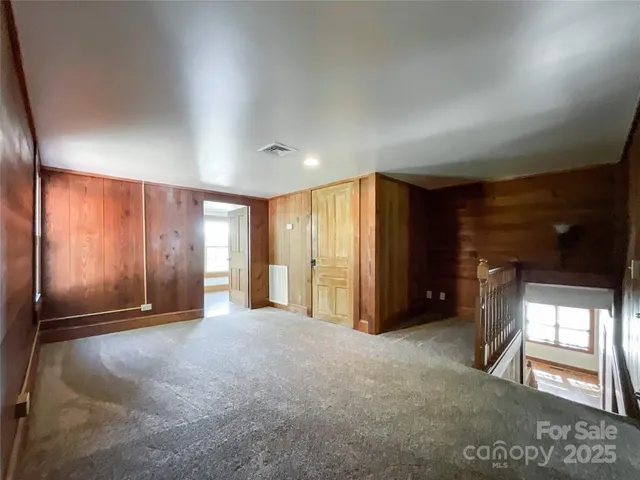 a view of empty room with windows