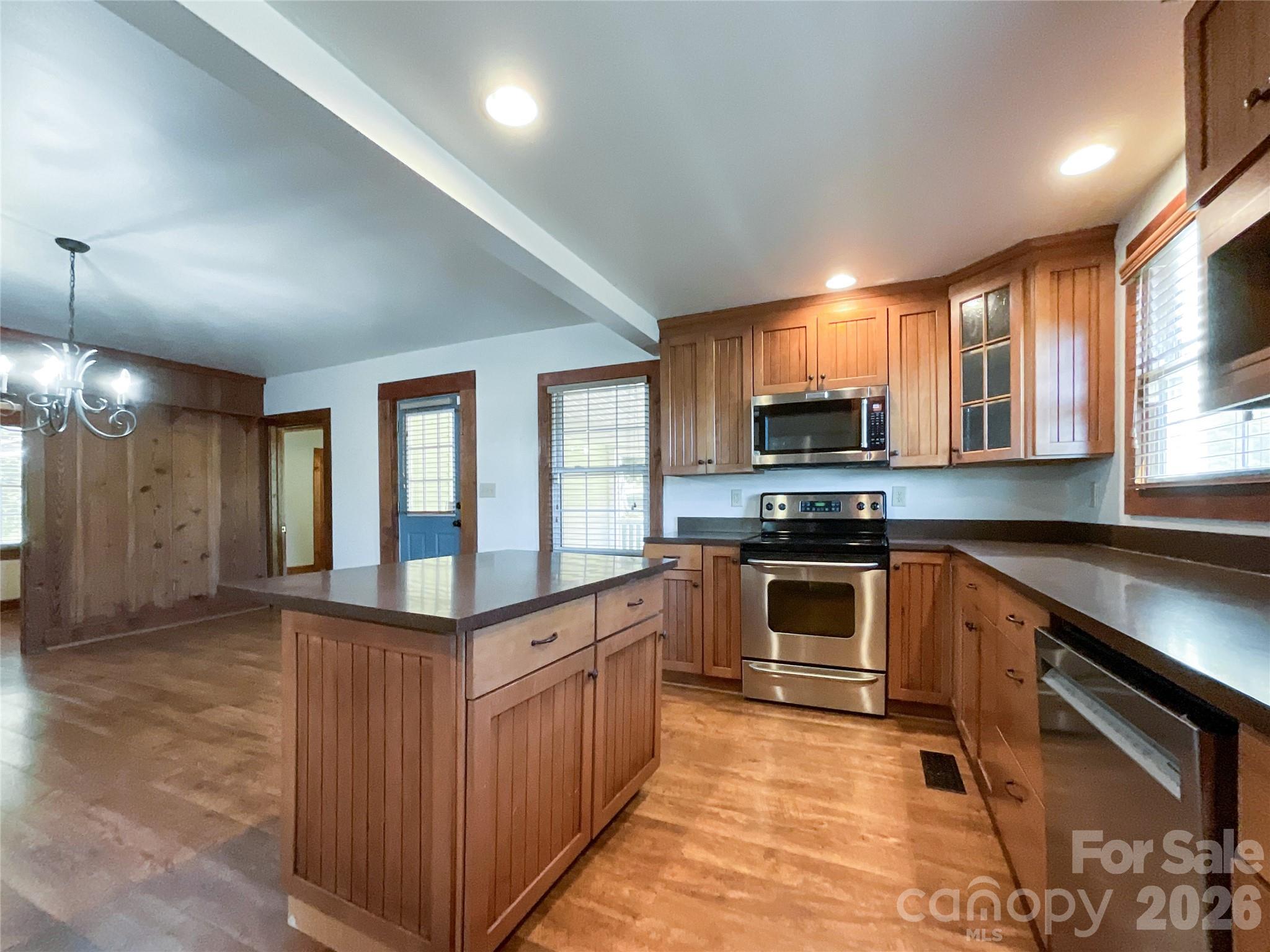 2006 Okeewemee Road Star, NC 27356 - Photo 10 of 47 a kitchen with stainless steel appliances granite countertop a stove and a sink