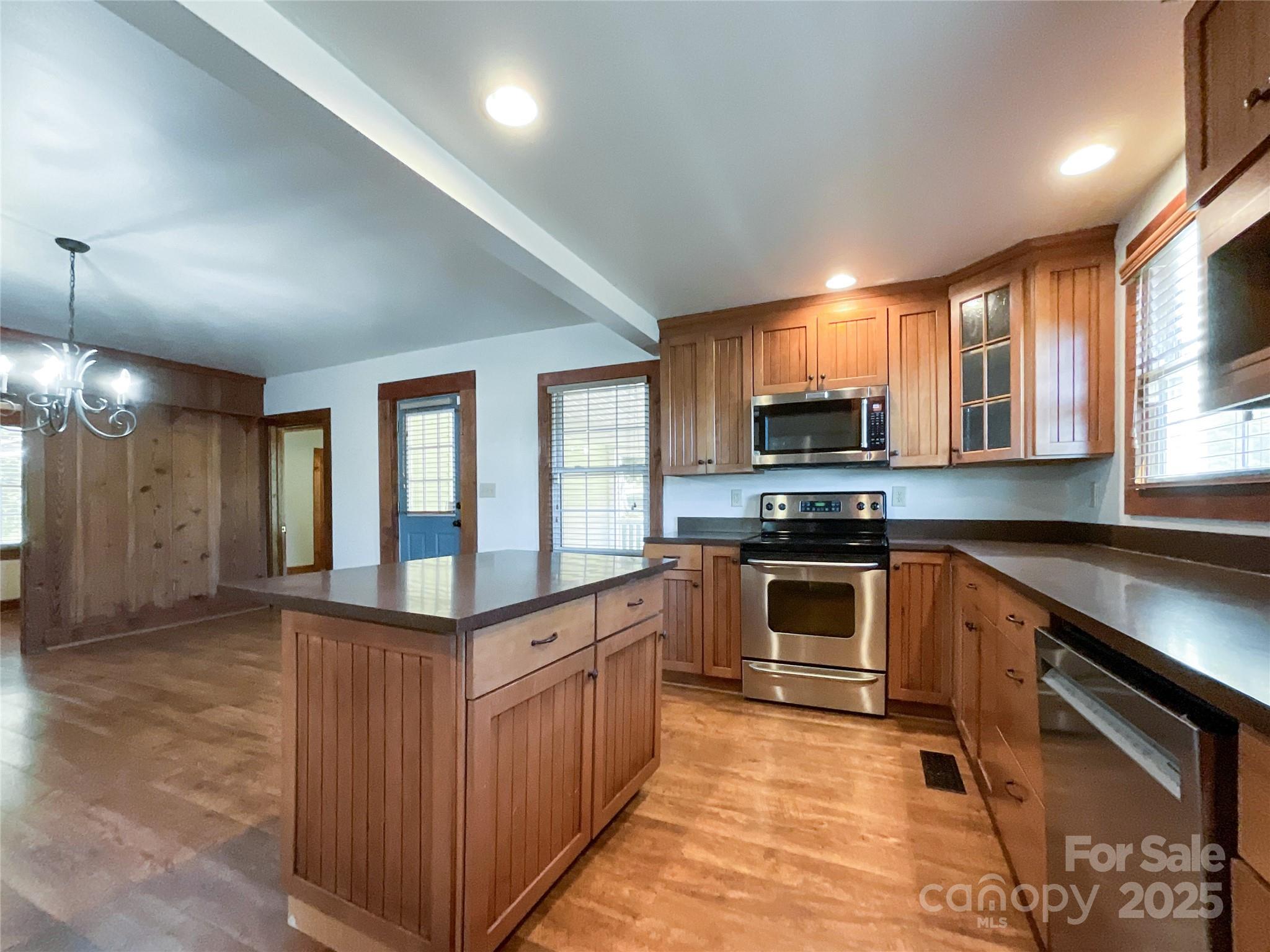 2006 Okeewemee Road Star, NC 27356 - Photo 10 of 48 a kitchen with stainless steel appliances granite countertop a stove and a sink