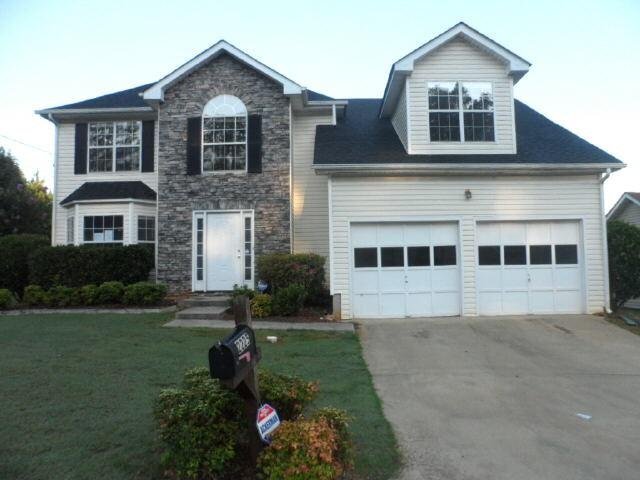 2225 Hidden Creek Drive Decatur, GA 30035 - Photo 1 of 1 a front view of a house with a yard