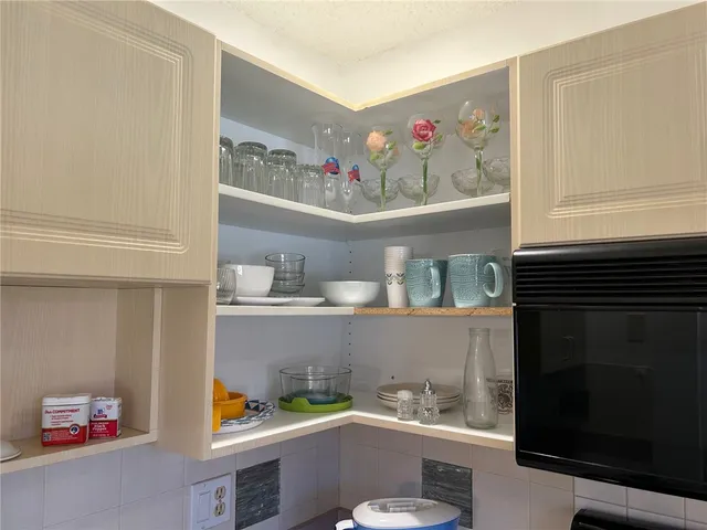 a room with furniture a sink and a window