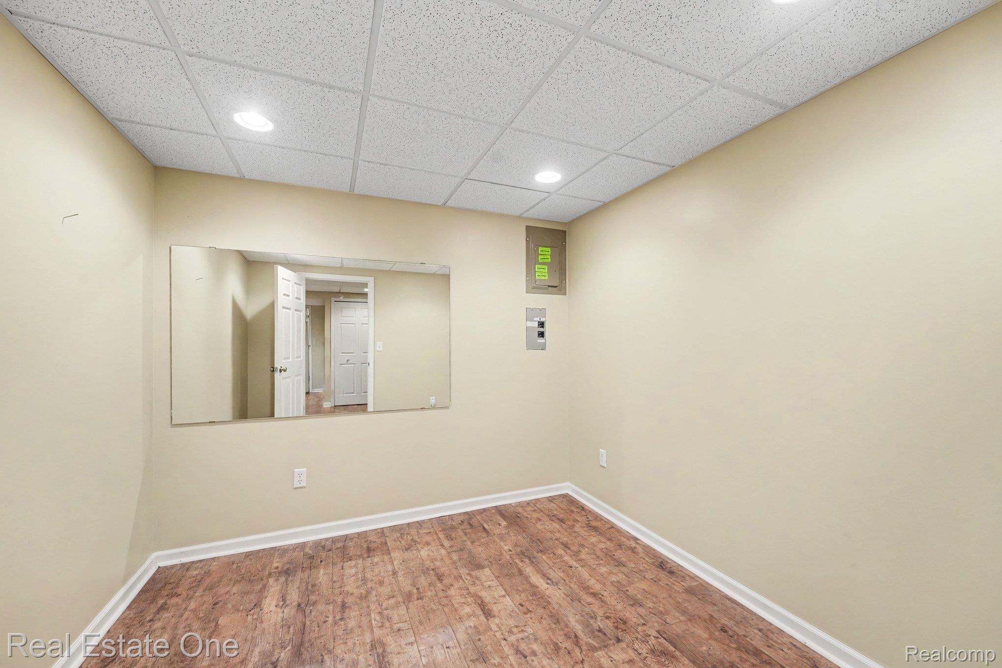 701 Charing Court Rochester, MI 48307 - Photo 22 of 29 Neutral wall paint, wood-finish flooring, and white trim