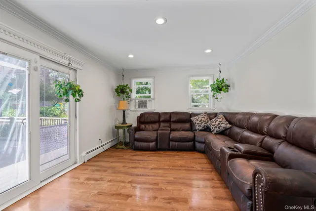 a view of entryway with stairs and wooden floor