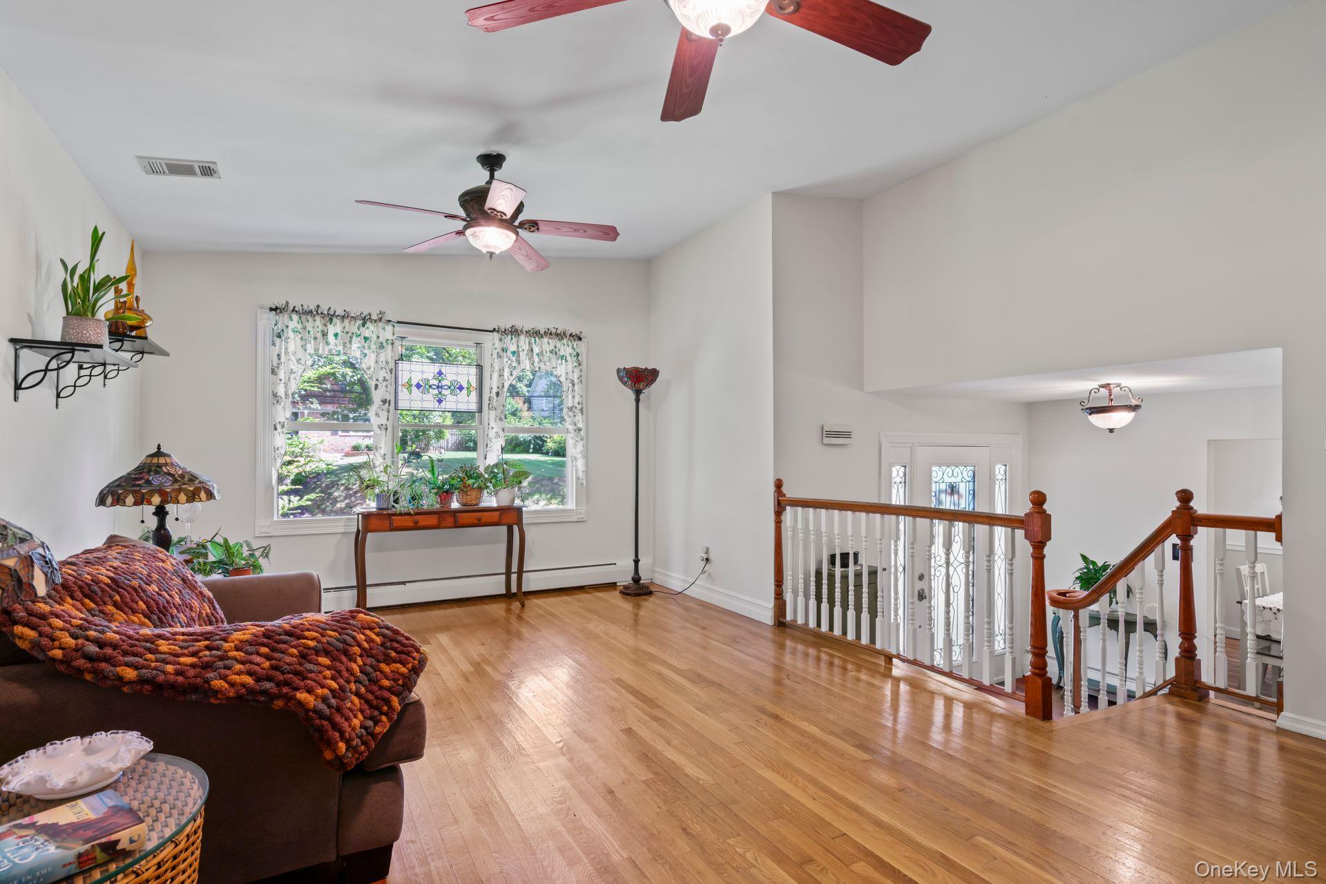 6 Emil Court Huntington, NY 11743 - Photo 12 of 25 a bedroom with furniture window and wooden floor