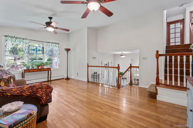 a bedroom with furniture window and wooden floor
