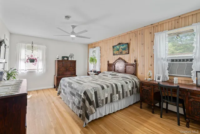 a bathroom with a sink and a mirror with toilet