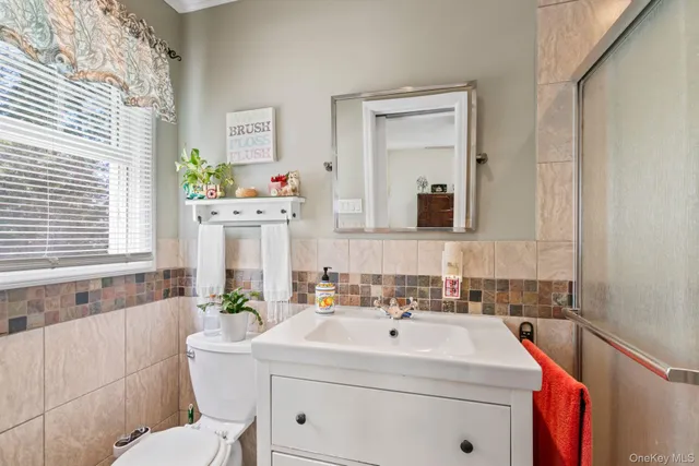 a living room with furniture windows and wooden floor