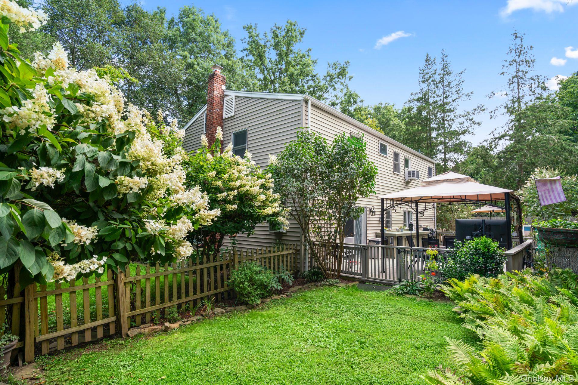 6 Emil Court Huntington, NY 11743 - Photo 21 of 25 a view of a house with backyard and garden