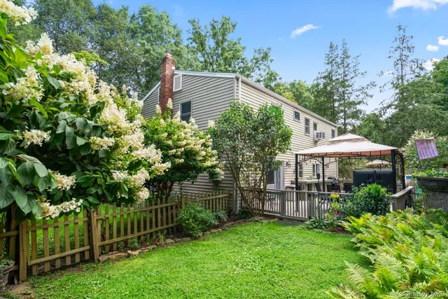 an outdoor space with furniture and umbrella