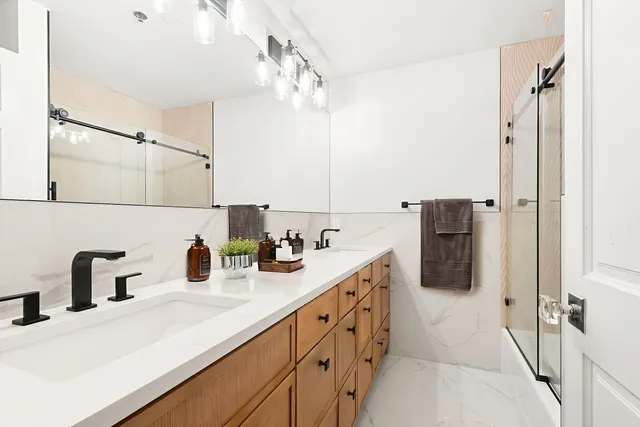 a kitchen with a sink and a refrigerator