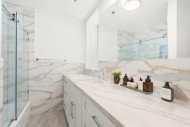 a bathroom with a sink and a mirror
