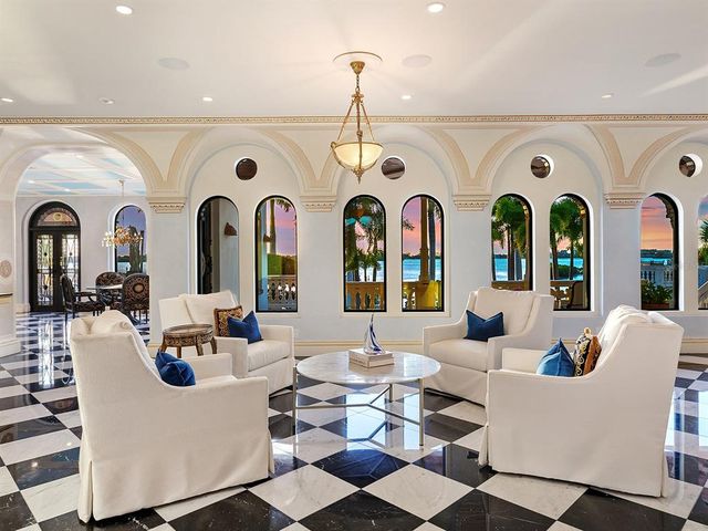 a view of entryway with a rug and wooden floor