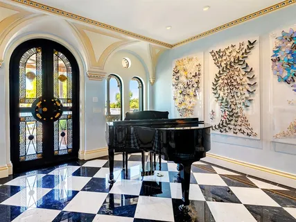 a large kitchen with a table and chairs