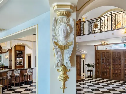 a kitchen with a sink a stove and cabinets