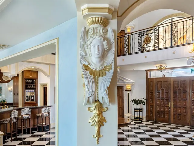 a kitchen with a sink a stove and cabinets
